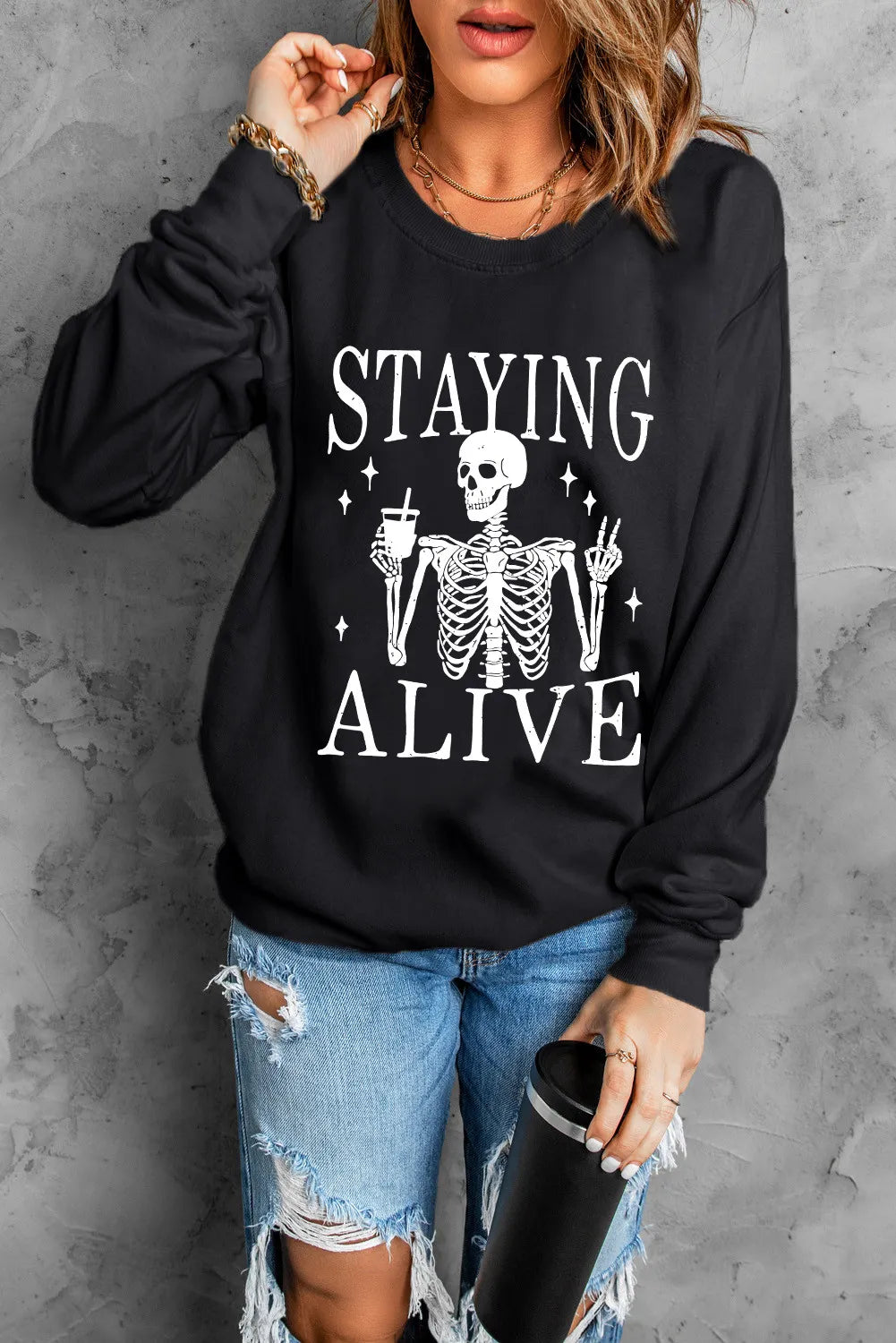 Time-Sensitive Skull Graphic Women's Staying Alive Long Sleeve Sweatshirt